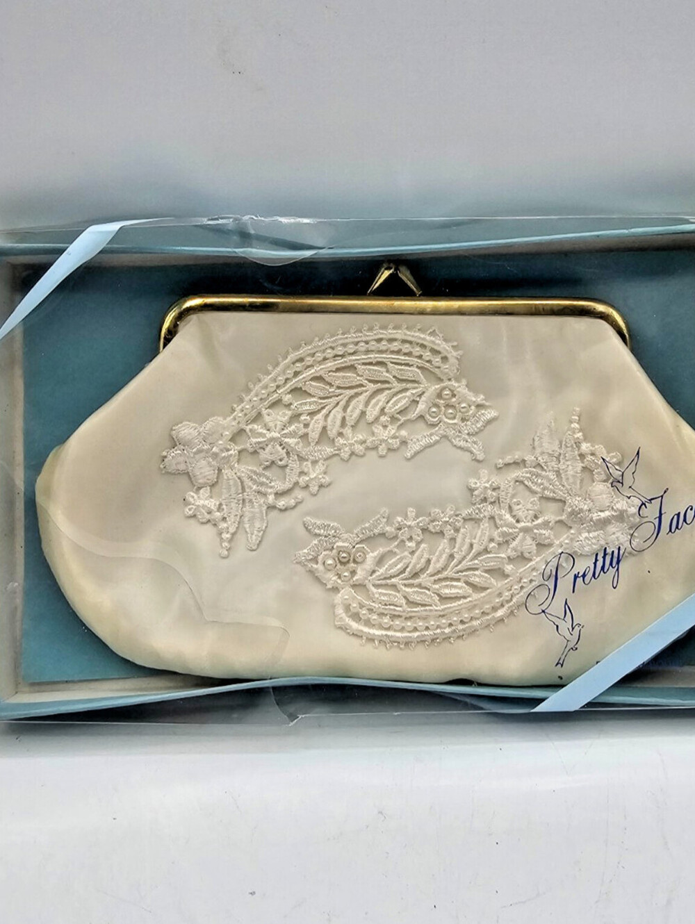 Vintage 1950s ivory satin clutch with embroidered lace and beaded details